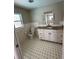 Clean bathroom with granite countertop and updated vanity at 2406 W Orange Blvd, Kissimmee, FL 34741
