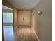 Light and bright entryway with double doors and wood flooring at 2406 W Orange Blvd, Kissimmee, FL 34741