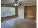 Spacious living room with large window and wood flooring at 2406 W Orange Blvd, Kissimmee, FL 34741