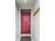 Inviting entryway with a red front door and a welcome mat at 976 August Sky Dr, Deltona, FL 32738