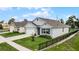 Houses with gray siding, dark gray shutters, and a shared driveway at 976 August Sky Dr, Deltona, FL 32738