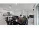 Dining area with dark wood table and chairs near kitchen at 976 August Sky Dr, Deltona, FL 32738