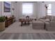 Living room with sectional sofa and round coffee table at 526 Marion Oaks Trl, Ocala, FL 34473