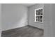 Simple bedroom with hardwood floors and one window at 526 Marion Oaks Trl, Ocala, FL 34473