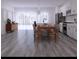 Open concept kitchen and dining area with gray flooring at 526 Marion Oaks Trl, Ocala, FL 34473