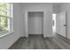 Bright bedroom with a spacious closet and wood-look floors at 526 Marion Oaks Trl, Ocala, FL 34473