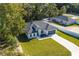 One-story house with gray roof and white siding, on a large lot at 526 Marion Oaks Trl, Ocala, FL 34473