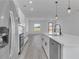 Open concept kitchen with island and stainless steel appliances at 526 Marion Oaks Trl, Ocala, FL 34473