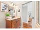 Bathroom vanity with wooden cabinetry, textured walls, and natural light at 732 Edgewater Dr, Orlando, FL 32804