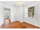 Bright bedroom with hardwood floors, large windows, and a ceiling fan at 732 Edgewater Dr, Orlando, FL 32804