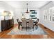 Formal dining room with chandelier, hardwood floors, and area rug at 732 Edgewater Dr, Orlando, FL 32804