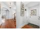 Bright entryway with stained glass door and hardwood floors at 732 Edgewater Dr, Orlando, FL 32804