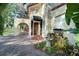 Spanish-style house with a fountain and lush landscaping at 732 Edgewater Dr, Orlando, FL 32804