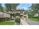 Two-story house with a brick driveway and mature trees at 732 Edgewater Dr, Orlando, FL 32804