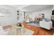 Living room with fireplace, white furniture, hardwood floors, and built-in shelves at 732 Edgewater Dr, Orlando, FL 32804