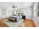 Large main bedroom with hardwood floors, plush rug, and sitting area at 732 Edgewater Dr, Orlando, FL 32804