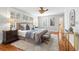Elegant main bedroom with hardwood floors, ceiling fan, and large windows at 732 Edgewater Dr, Orlando, FL 32804