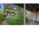 View of the house from the backyard, with lush greenery and a patio at 732 Edgewater Dr, Orlando, FL 32804