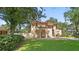 Two-story house with tile roof and large, grassy yard at 732 Edgewater Dr, Orlando, FL 32804