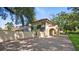 Two-story house with tile roof, ivy, and gated driveway at 732 Edgewater Dr, Orlando, FL 32804