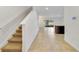 Spacious entryway with tile flooring and staircase leading upstairs at 9021 Carlotta Way, Kissimmee, FL 34747