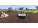 Community playground with swings, slides, and play structures at 9021 Carlotta Way, Kissimmee, FL 34747