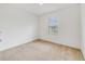 Simple bedroom with neutral carpet and window at 9021 Carlotta Way, Kissimmee, FL 34747