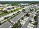 Aerial view of townhouses and surrounding neighborhood at 9021 Carlotta Way, Kissimmee, FL 34747