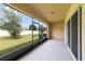Screened porch overlooking a grassy backyard at 9021 Carlotta Way, Kissimmee, FL 34747
