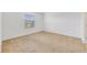 Spacious bedroom with neutral carpet and large window at 9021 Carlotta Way, Kissimmee, FL 34747