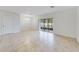 Spacious dining area with tile flooring and access to backyard at 9021 Carlotta Way, Kissimmee, FL 34747