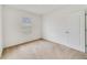 Bright bedroom with neutral walls and carpet at 9021 Carlotta Way, Kissimmee, FL 34747