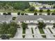 Aerial view of townhouses with driveways and landscaping at 9021 Carlotta Way, Kissimmee, FL 34747
