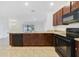 Open kitchen with breakfast bar, stainless steel appliances, and ample counter space at 9021 Carlotta Way, Kissimmee, FL 34747
