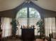Living room with vaulted ceiling, large window, and wet bar at 575 Bloomington Ct # 27, Altamonte Springs, FL 32714