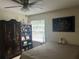 Spacious bedroom with a queen bed, ceiling fan, and ample closet space at 575 Bloomington Ct # 27, Altamonte Springs, FL 32714