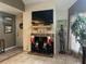 Fireplace with TV above and nutcrackers and suit of armor at 575 Bloomington Ct # 27, Altamonte Springs, FL 32714