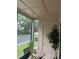 Private screened porch with patio furniture and lush greenery views at 575 Bloomington Ct # 27, Altamonte Springs, FL 32714