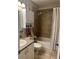 Updated bathroom with a tub shower, double vanity, and overhead cabinet at 575 Bloomington Ct # 27, Altamonte Springs, FL 32714