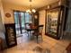Bright dining area with a wooden table and chairs, near sliding doors at 575 Bloomington Ct # 27, Altamonte Springs, FL 32714