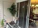 Small patio with table and chairs, offering access to the kitchen and dining area at 575 Bloomington Ct # 27, Altamonte Springs, FL 32714