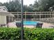 Inviting community pool with lounge chairs and lush greenery at 575 Bloomington Ct # 27, Altamonte Springs, FL 32714
