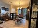 Bright dining area with a wooden table and chairs, near sliding doors at 575 Bloomington Ct # 27, Altamonte Springs, FL 32714