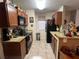 Galley style kitchen with granite countertops and dark cabinets at 575 Bloomington Ct # 27, Altamonte Springs, FL 32714
