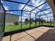 Spacious screened patio with paver floor and lake view at 1075 Trappers Trail Loop, Davenport, FL 33896