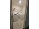 Bright laundry room with washer, dryer, and shelving at 1075 Trappers Trail Loop, Davenport, FL 33896