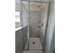 Clean shower with tiled walls and a glass enclosure at 1075 Trappers Trail Loop, Davenport, FL 33896