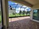 Spacious screened patio with paver tile floor, perfect for outdoor relaxation at 1075 Trappers Trail Loop, Davenport, FL 33896