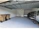 Attached garage with overhead storage and extra freezer at 1075 Trappers Trail Loop, Davenport, FL 33896