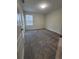 Spacious bedroom with neutral carpeting and large window at 1075 Trappers Trail Loop, Davenport, FL 33896